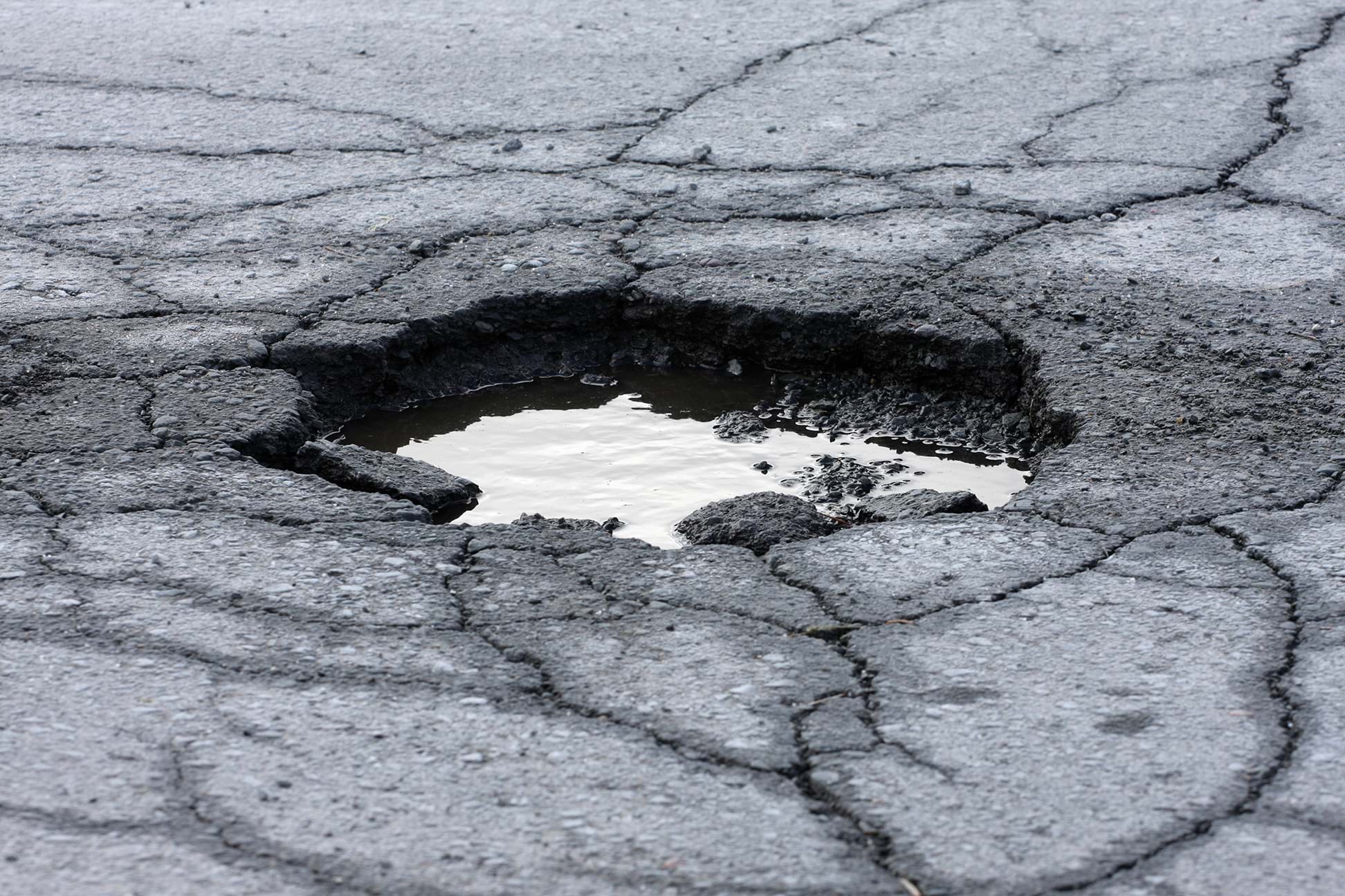 pothole filled with water